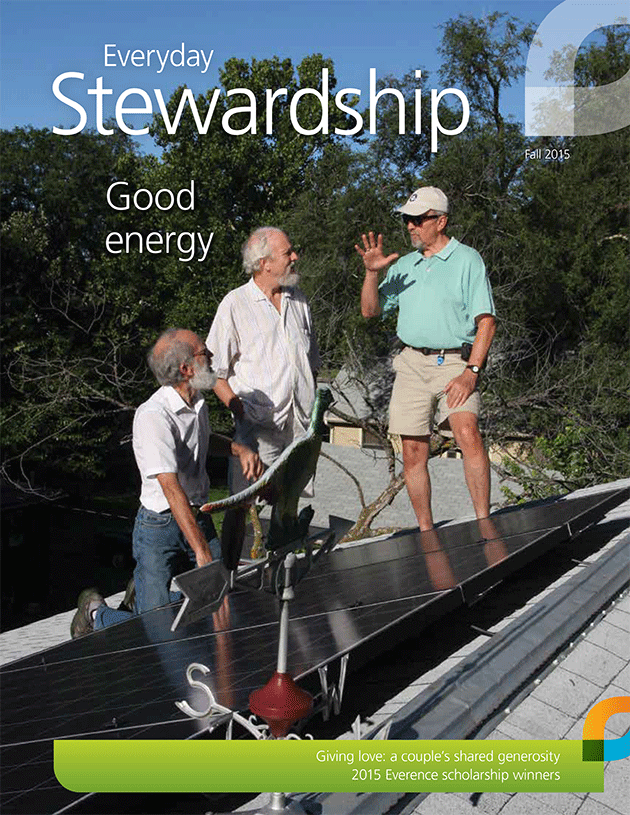 3 mature men Dean Denner, Bill Dorsett and Dave Redmon check on solar panels 